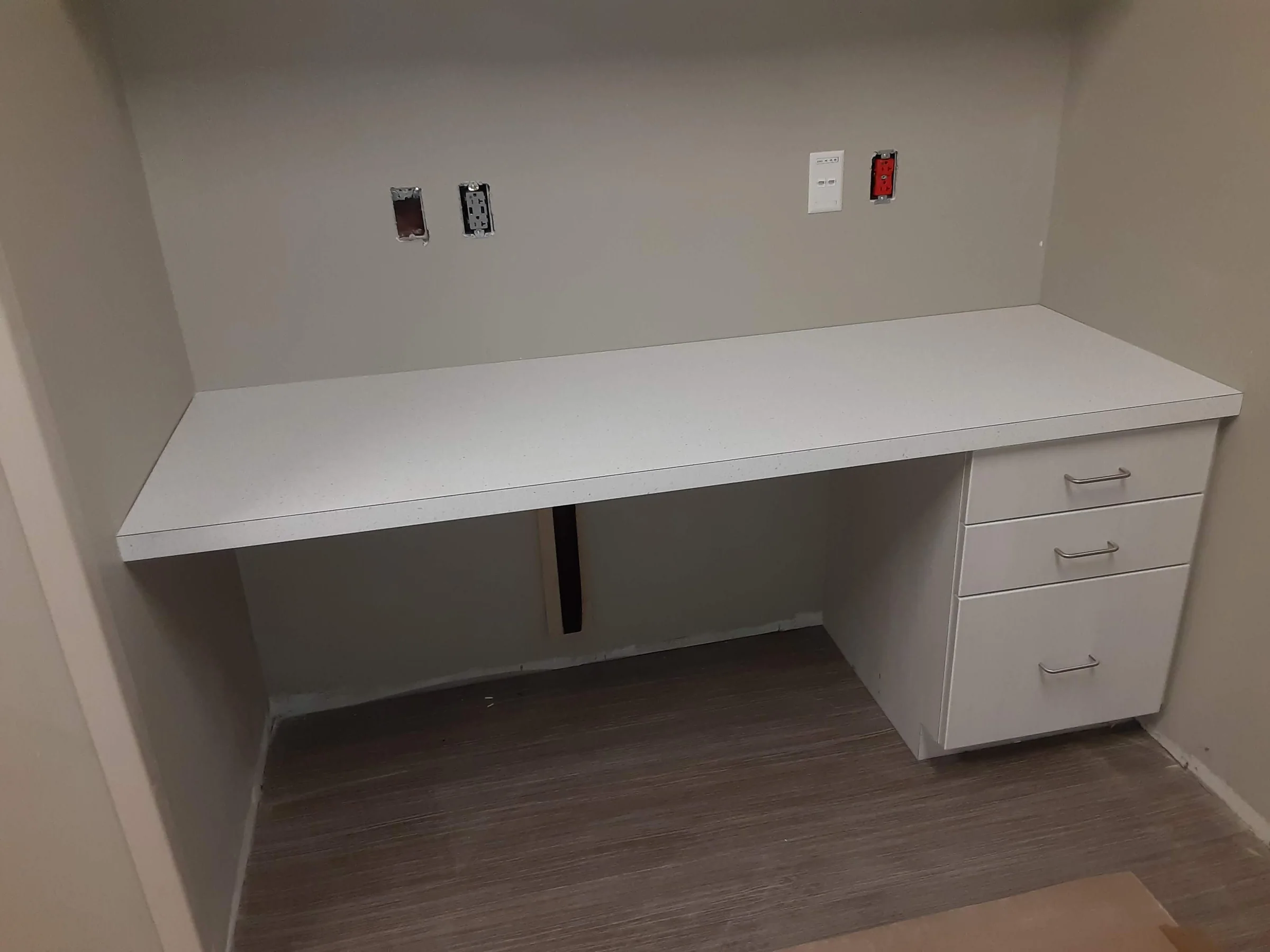 White built-in commercial workstation with drawer storage
