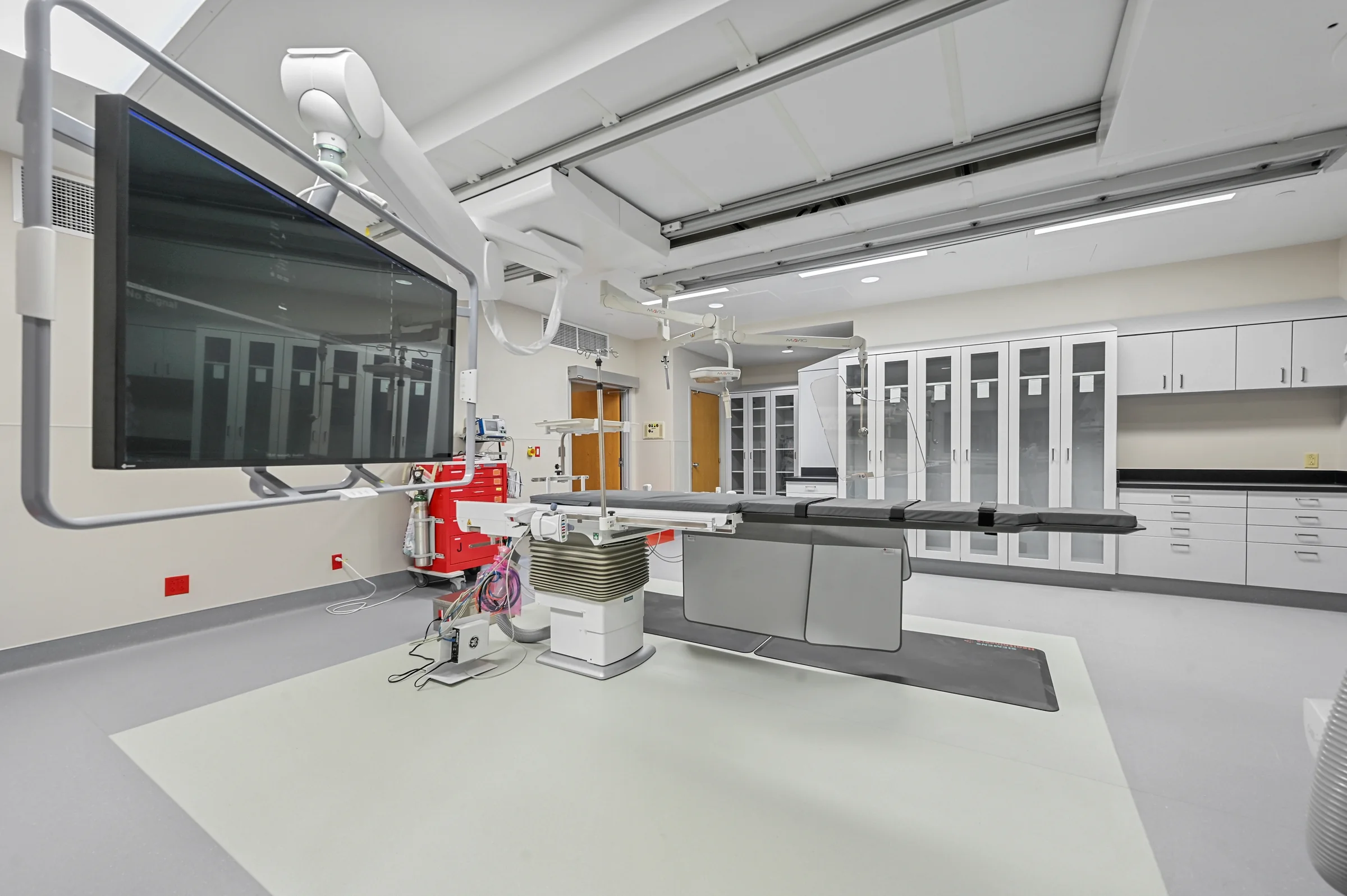 Wide view of cabinetry installed in a completed clinical procedure room